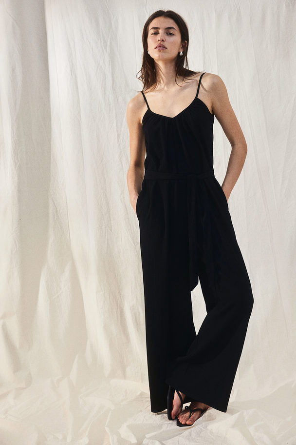 H&M Jumpsuit aus Jersey mit Bindegürtel Schwarz