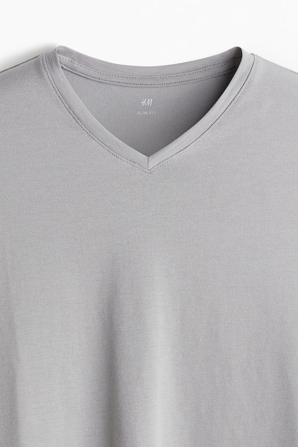 H&M 3er-Pack T-Shirts mit V-Ausschnitt Slim Fit Schwarz/Grau/Weiß