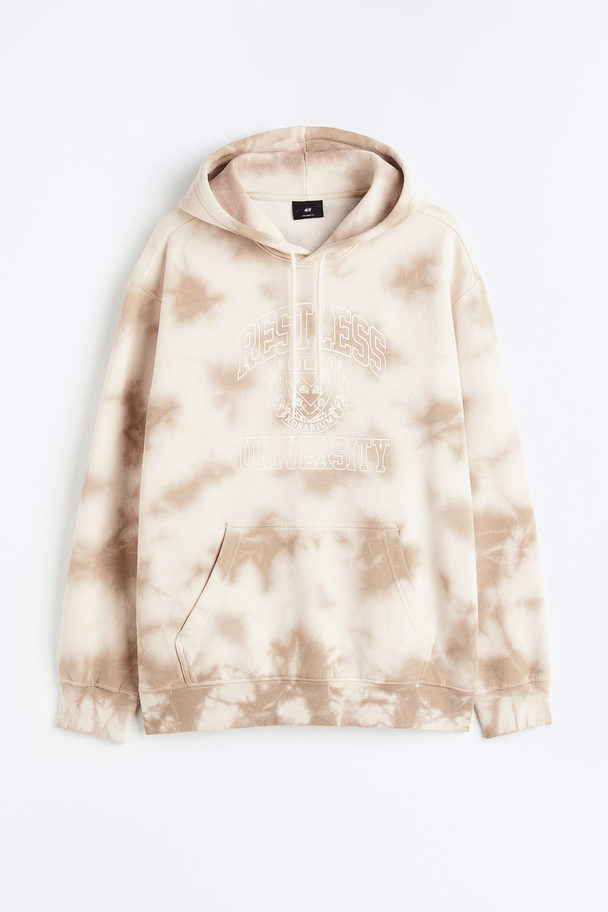 H&M Hoodie mit Print Relaxed Fit Beige/Restless University