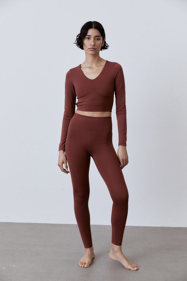 H&M Softmove™ Cropped Sports Top Rust Brown