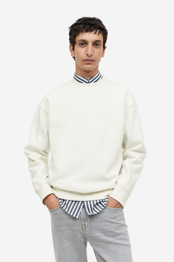 H&M Sweatshirt mit Applikation Relaxed Fit Cremefarben