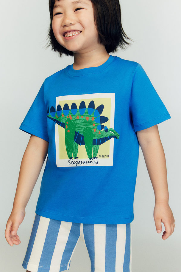 H&M T-Shirt mit Print Knallblau/Dinosaurier