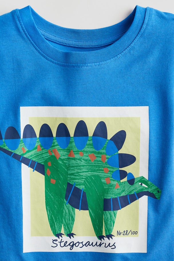 H&M T-Shirt mit Print Knallblau/Dinosaurier