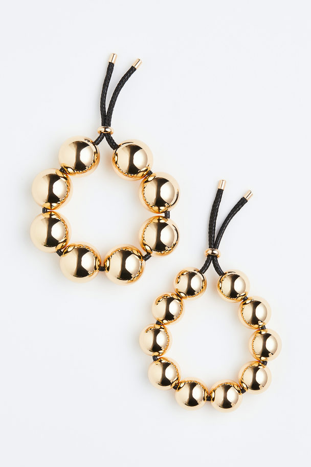 H&M 2er-Pack Armbänder mit Perlen