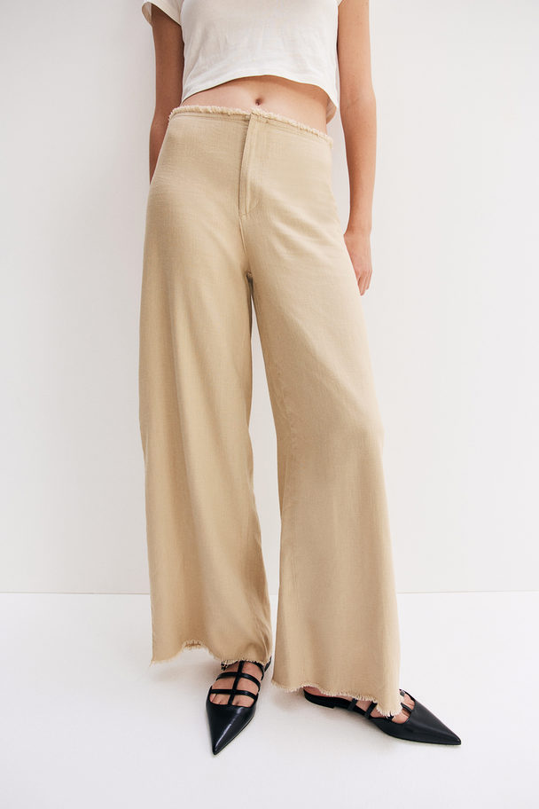 H&M Hose aus Leinenmix mit Fransenkante Beige