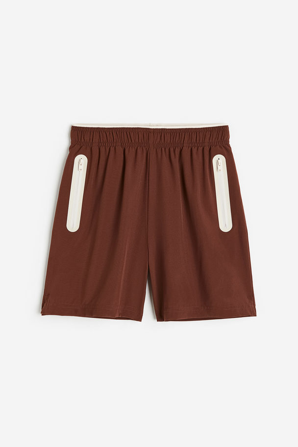 H&M DryMove™ Sportshorts Dunkelbraun