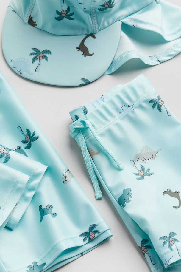 H&M Sonnenschutz-Set mit UPF 50 Hellblau/Dinosaurier