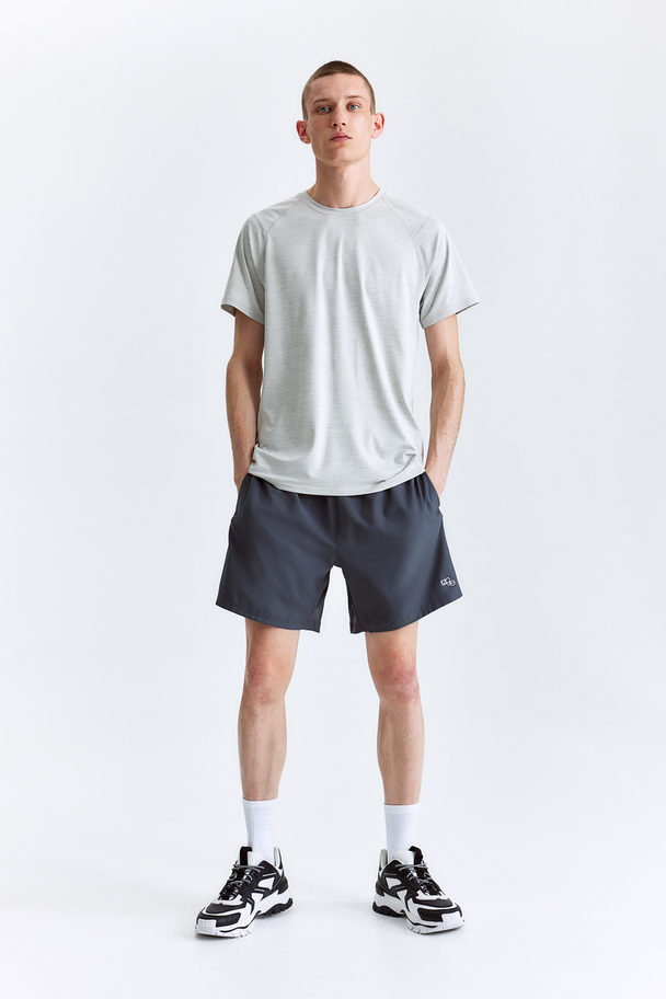 H&M Sportshirt Van Drymove™ - Muscle Fit Pro Lichtgrijs Gemêleerd