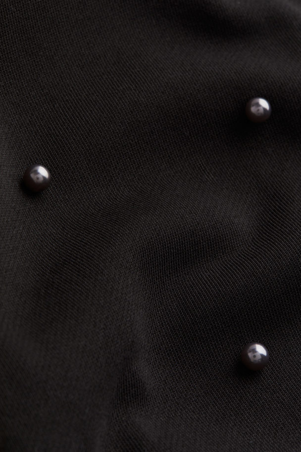 H&M Sweatshirt mit Perlenstickereien Schwarz/Perlen