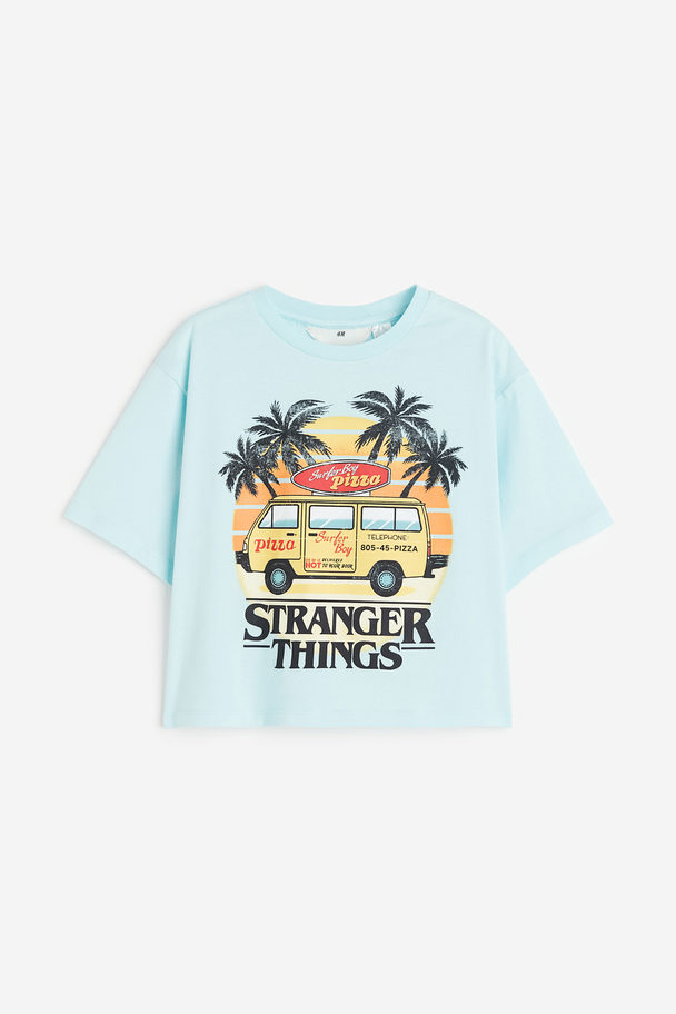 H&M Oversized T-Shirt mit Print Hellblau/Stranger Things
