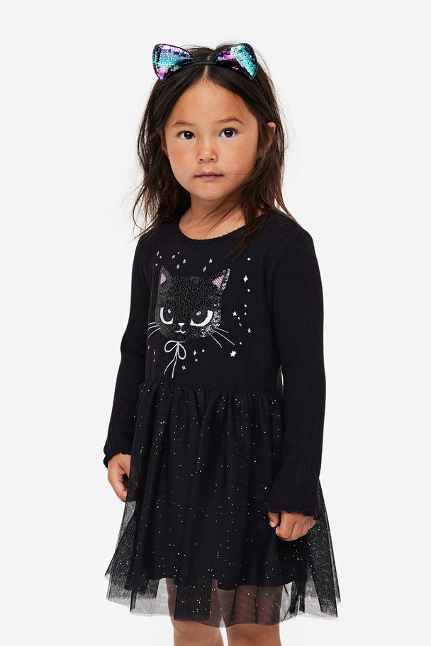 H&M Kleid mit Tüllrock und Paillettenmotiv Schwarz/Katze