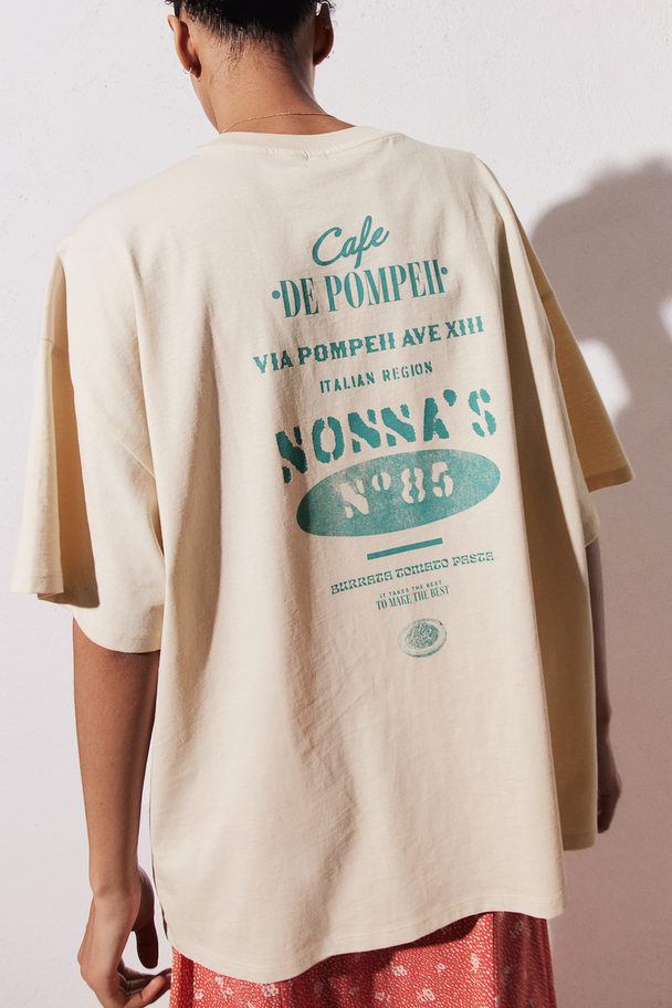 H&M Oversized T-Shirt mit Motivdetail Hellbeige/Cafe de Pompeii