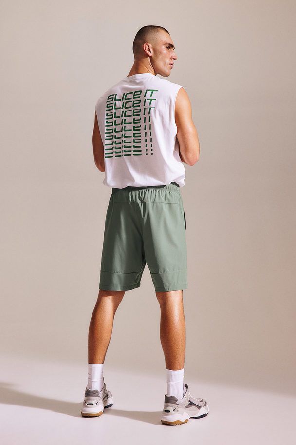 H&M DryMove™ Sportshorts aus 4-Wege-Stretch Khakigrün