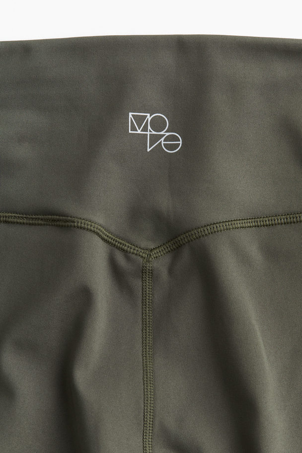 H&M DryMove ™ Sportleggings mit Taschendetail Khakigrün