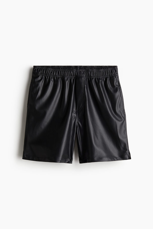 H&M Beschichtete Shorts in Relaxed Fit Schwarz