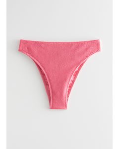 Strukturierte Bikinihose im Tangaschnitt Rosa