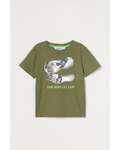 T-Shirt mit interaktivem Motiv Khakigrün/Dinosaurier
