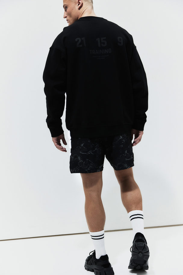 H&M DryMove™ Sweatshirt mit Printdetail Schwarz