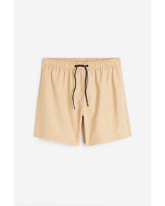 Badeshorts mit wasseraktiviertem Muster Beige/Schlangenmuster