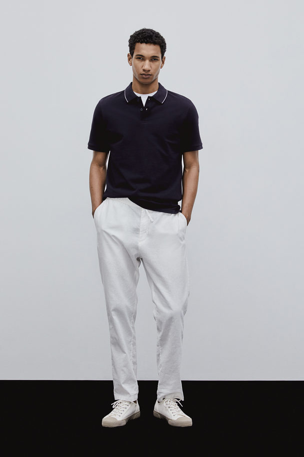 H&M Poloshirt aus Baumwolle Slim Fit Dunkelblau