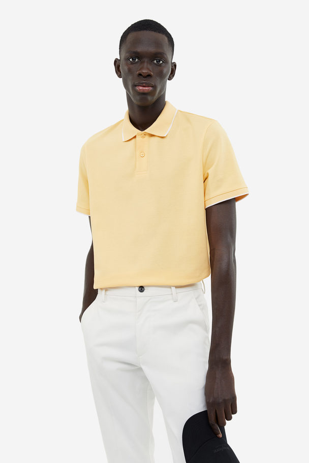 H&M Poloshirt aus Baumwolle Slim Fit Gelb