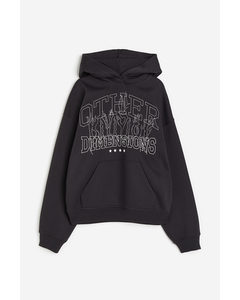 Oversized Hoodie mit Motiv Schwarz/Other Dimensions