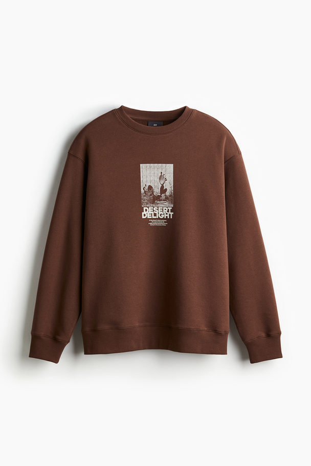 H&M Bedrucktes Sweatshirt in Loose Fit Braun/Desert Delight