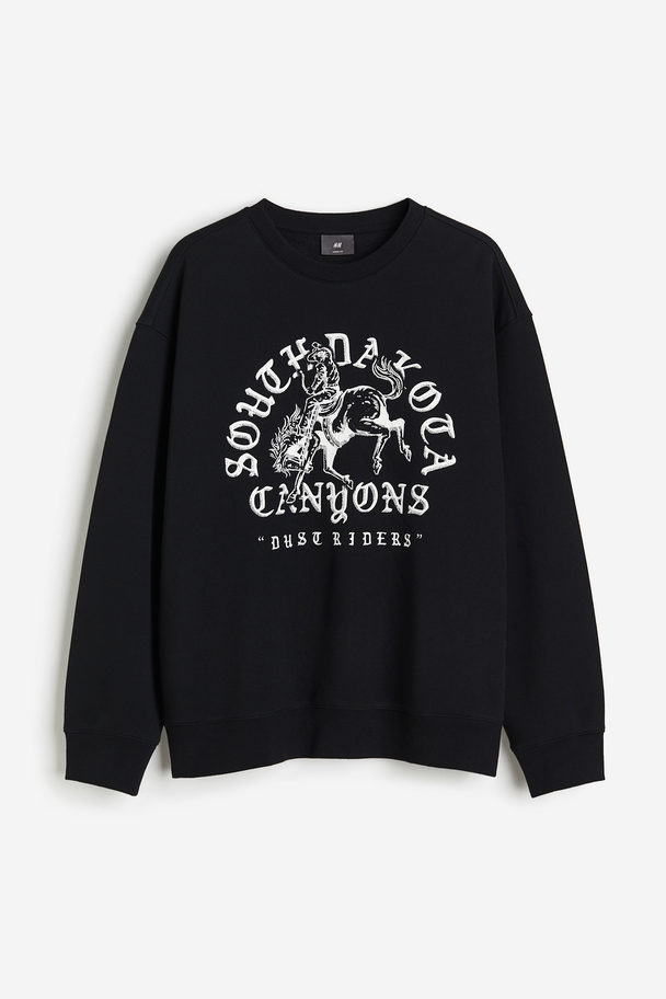H&M Bedrucktes Sweatshirt in Loose Fit Schwarz/South Dakota Canyons
