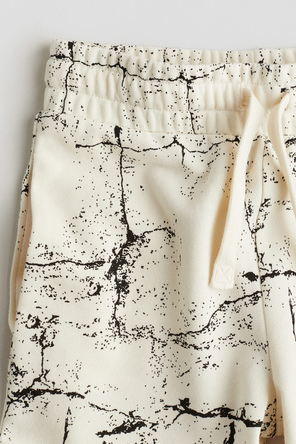 H&M Sweatshorts mit Print Weiß/Gemustert