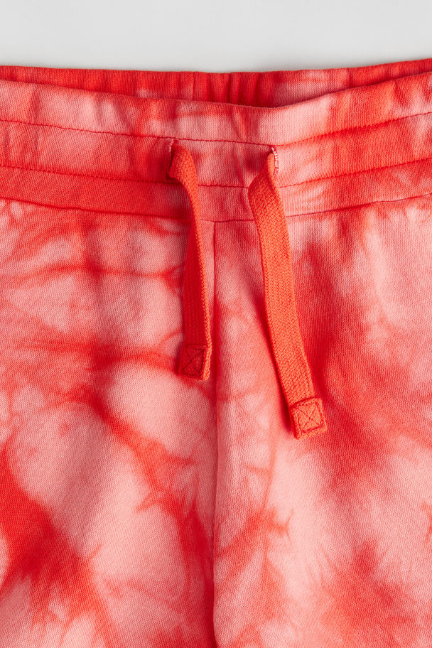 H&M Sweatshorts mit Print Knallrot/Batikmuster