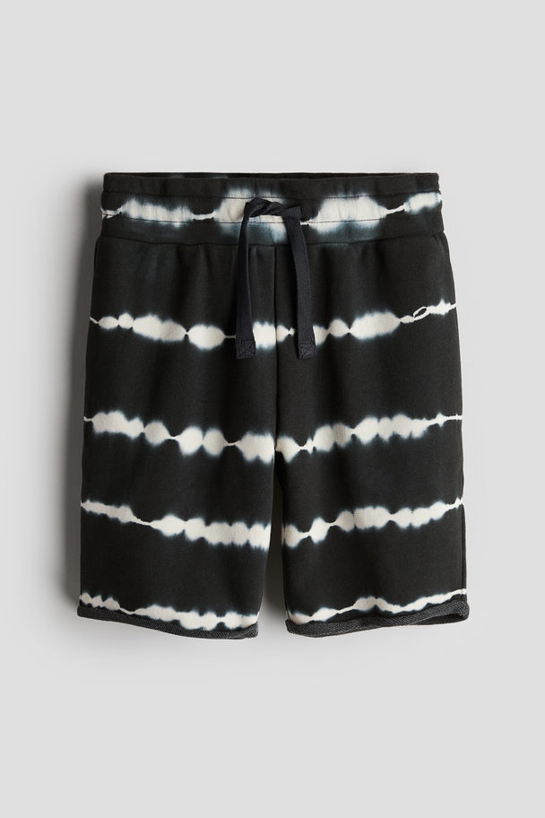 H&M Sweatshorts mit Print Schwarz/Batikmuster