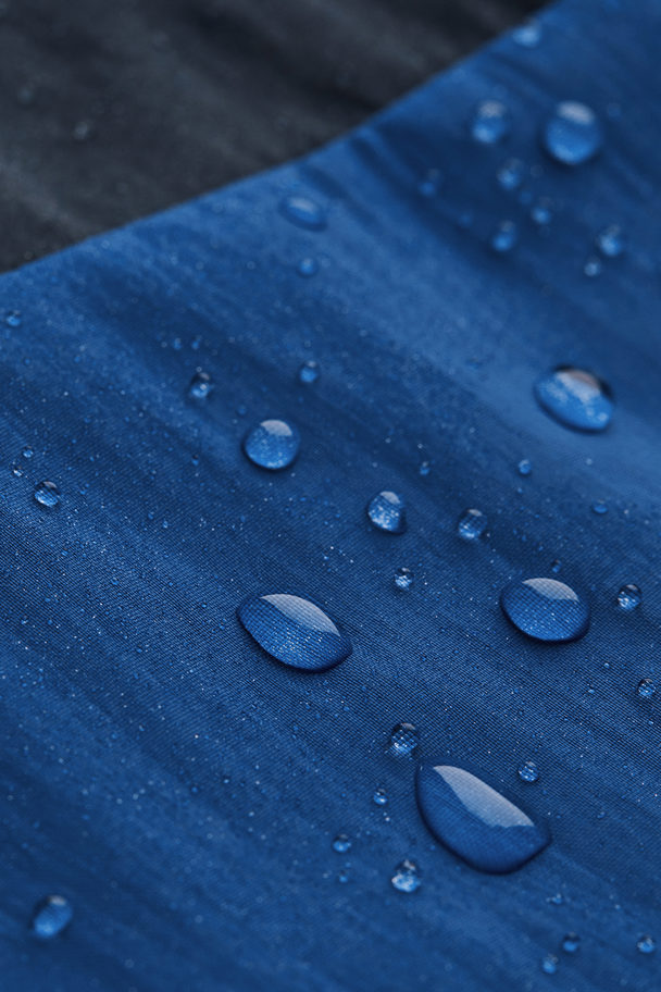 H&M Waterafstotende Trackpants Donkerblauw/helderblauw