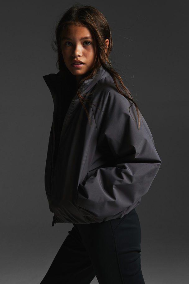 H&M Wattierte Jacke aus wasserabweisendem ThermoMove™ Dunkelgrau