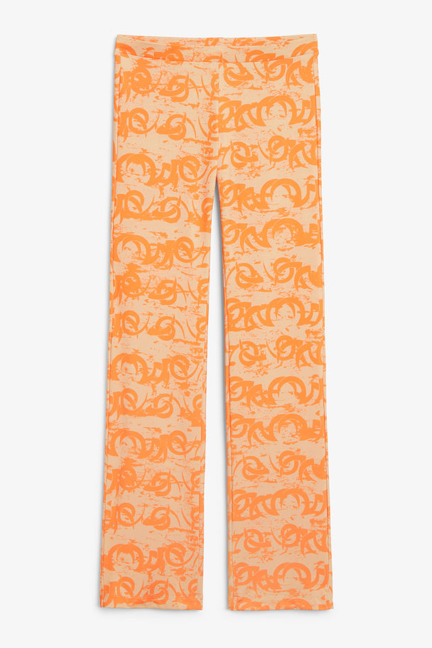 Monki Low Waist Flared Trousers Beige & Orange Print