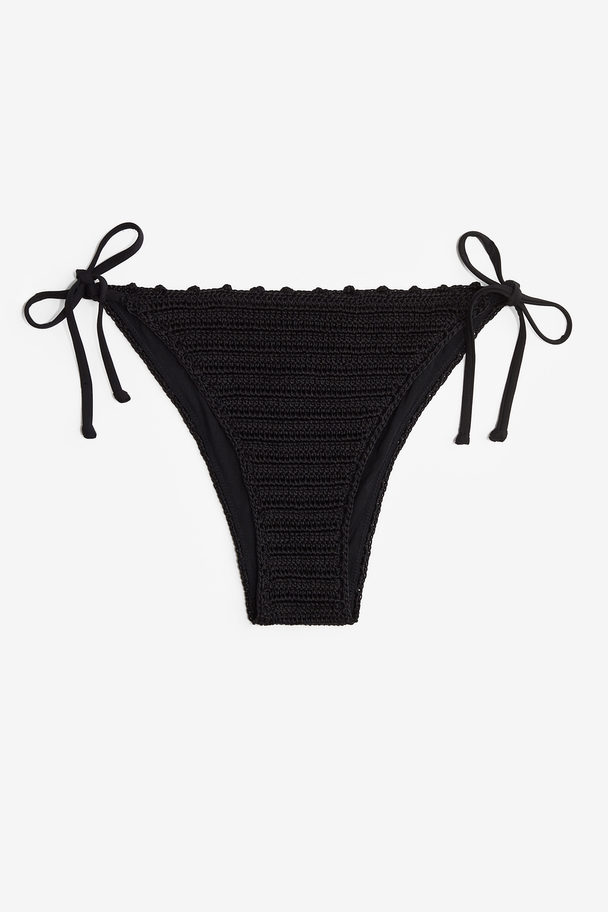 H&M Tanga-Bikinihose im Häkellook mit Bindebändern Schwarz