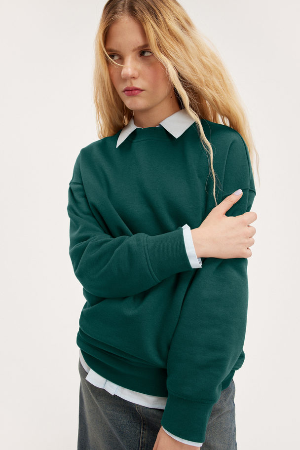 Monki Grüner Oversize-Pullover mit Rundhalsausschnitt Grün