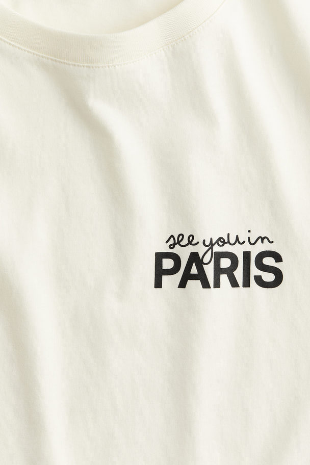 H&M T-Shirt aus Baumwolle Cremefarben/Paris