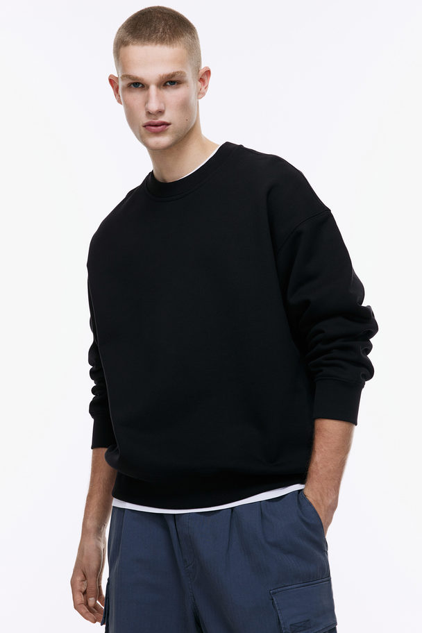 H&M Baumwollsweatshirt Oversized Fit Schwarz