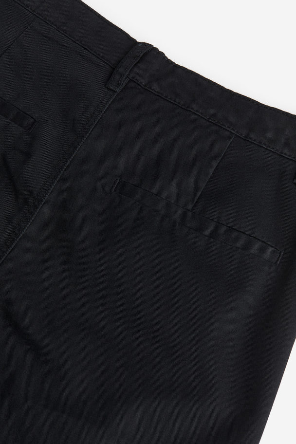 H&M Chino Relaxed Fit Schwarz