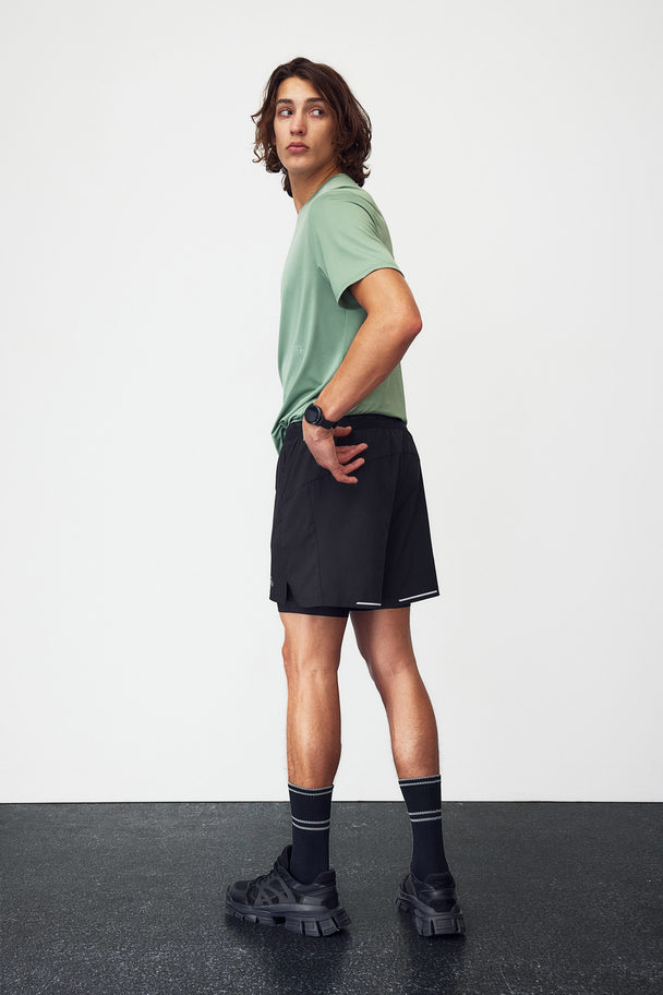 H&M DryMove™ Doppellagige Laufshorts Schwarz