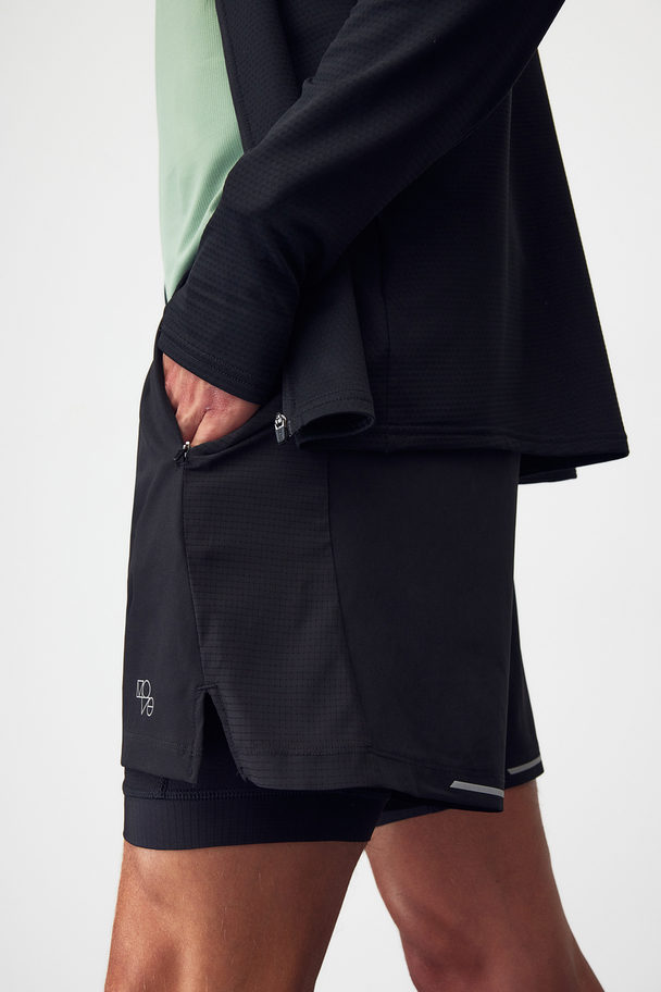 H&M DryMove™ Doppellagige Laufshorts Schwarz