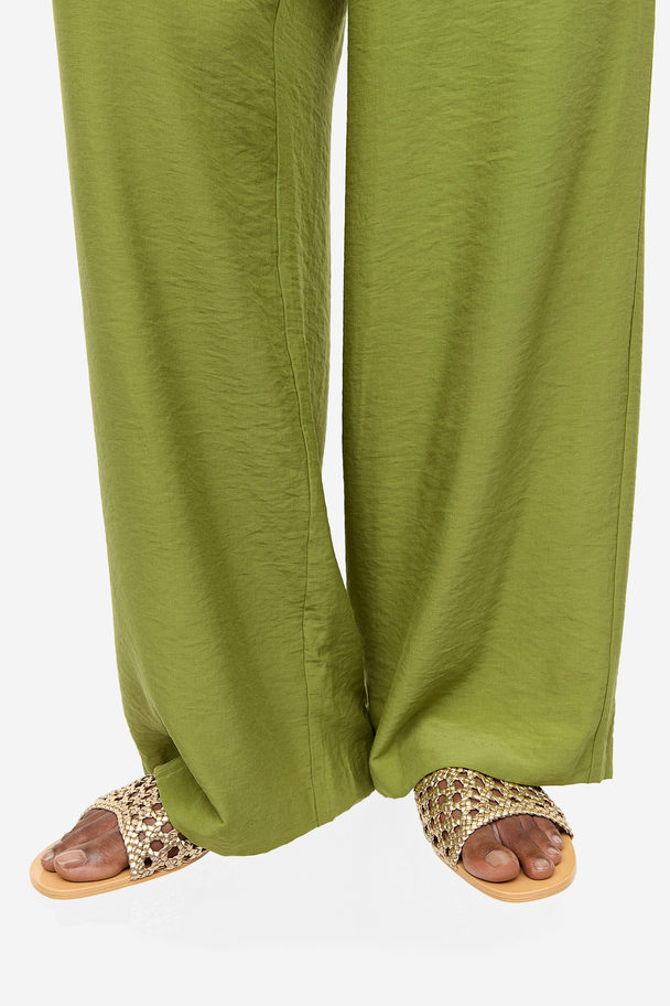 H&M Pantoletten mit Flechtdetail Goldfarben
