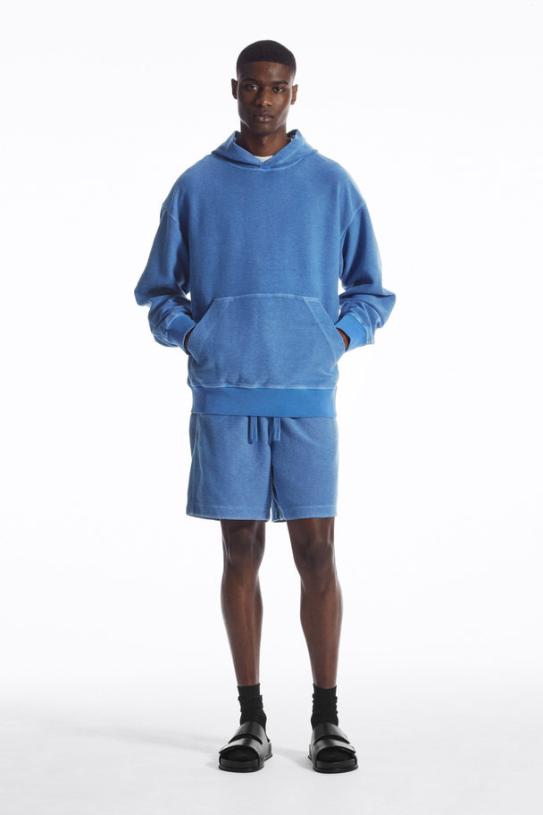 COS KAPUZENPULLOVER AUS FROTTEE Blau