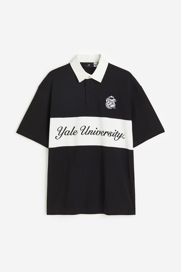 H&M Poloshirt mit Motiv Relaxed Fit Schwarz/Yale University