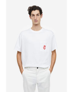T-Shirt mit Stickdetail Relaxed Fit Weiß/Blume