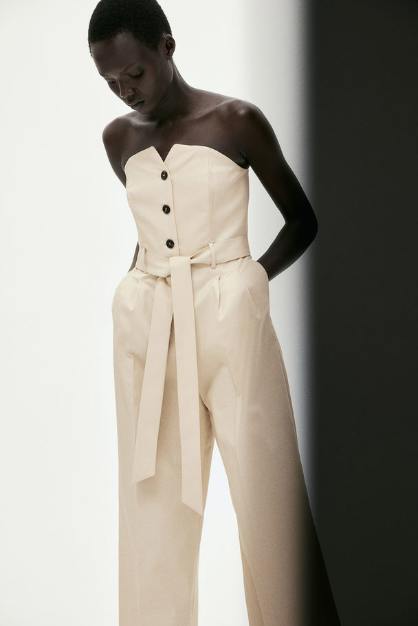 H&M Bandeau-Jumpsuit mit Bindegürtel Hellbeige